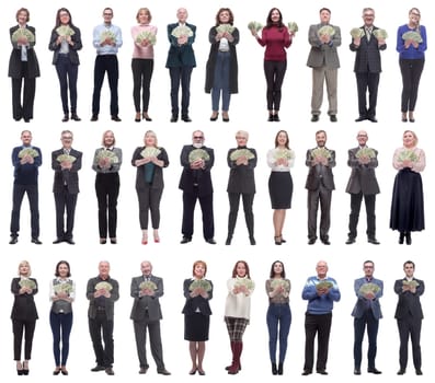 group of successful people with money in their hands looking at the camera on a white background