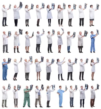 group of doctors holding x-ray isolated on white background