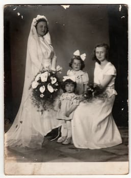 THE CZECHOSLOVAK SOCIALIST REPUBLIC - CIRCA 1950s: Vintage photo shows bride and bridesmaids