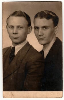 THE CZECHOSLOVAK SOCIALIST REPUBLIC - CIRCA 1950s: Vintage studio photo portrait shows young men. An antique Black & White photo