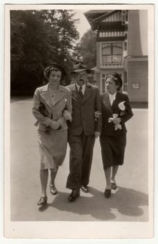 THE CZECHOSLOVAK REPUBLIC - CIRCA 1930s: Retro photo shows man and two women