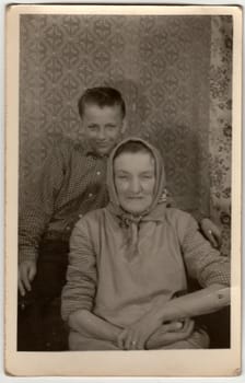 THE CZECHOSLOVAK SOCIALIST REPUBLIC - CIRCA 1960s: Vintage photo shows grandson with grandmother.