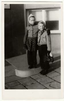 HODONIN, THE CZECHOSLOVAK REPUBLIC, CIRCA 1948: A vintage photo of the young girls. Girls go skating.