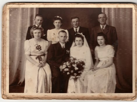 THE CZECHOSLOVAK REPUBLIC - CIRCA 1940s: An antique Black & White photo shows newlyweds and wedding guests.