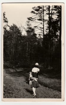 THE CZECHOSLOVAK SOCIALIST REPUBLIC - CIRCA 1960s: A vintage photo shows people outdoors