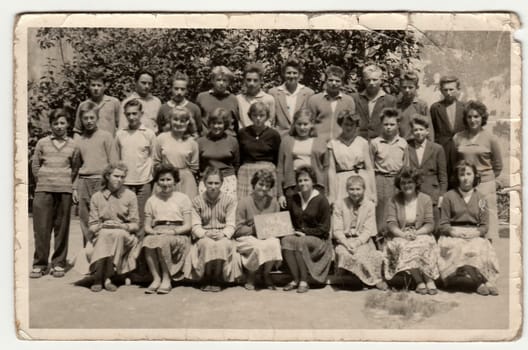 THE CZECHOSLOVAK SOCIALIST REPUBLIC - 1961: A vintage photo shows schoolmates with female teacher.