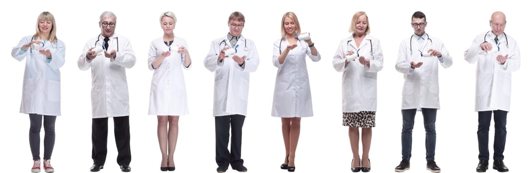 group of doctors holding jar isolated on white background