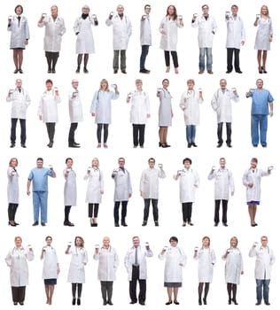 full length group of doctors showing badge isolated on white background