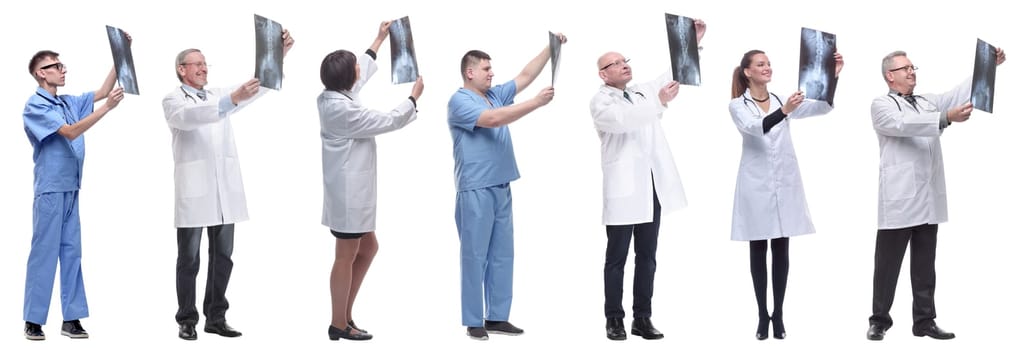 group of doctors holding x-ray isolated on white background