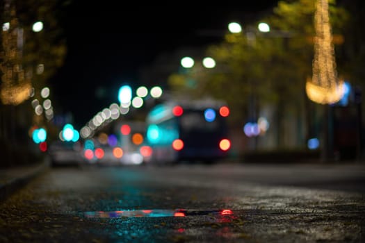 Blurred footage of transport. Blur of city lights along the road, light out of focus at night. Night city traffic, beautiful background