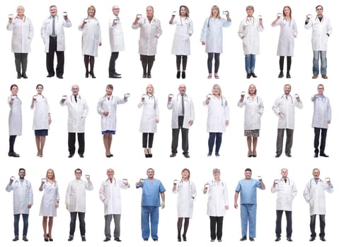 full length group of doctors showing badge isolated on white background