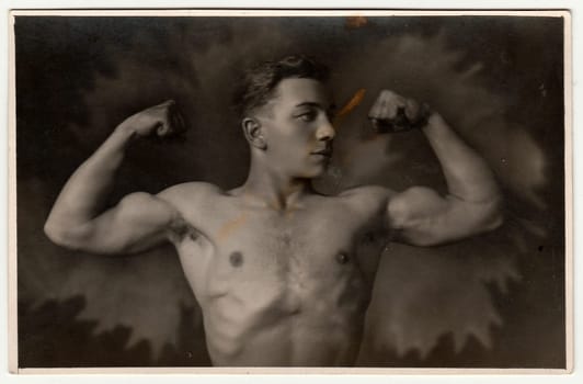 THE CZECHOSLOVAK REPUBLIC - CIRCA 1930s: Vintage photo shows young boy with muscular body. Antique black white photo.