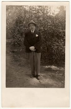 PREROV, THE CZECHOSLOVAK REPUBLIC - SEPTEMBER 30, 1928: Vintage photo shows young man poses in the city park.