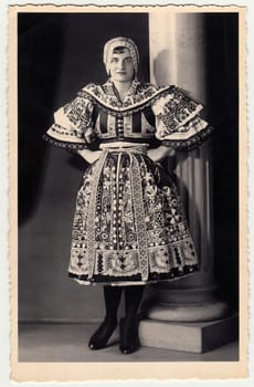 HODONIN, THE CZECHOSLOVAK REPUBLIC - CIRCA 1920s: Vintage photo shows woman in a folk costum.