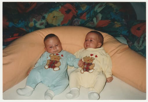 SWITZERLAND - CIRCA 1995: Vintage photo shows babies twins.