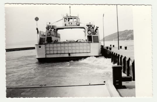 HUNGARY - 1966: Vintage photo shows ship transports cars on board.