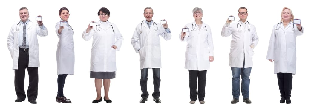 full length group of doctors showing badge isolated on white background