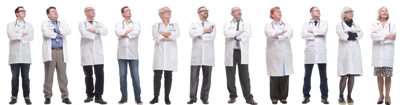 group of doctors standing in full length isolated on white background