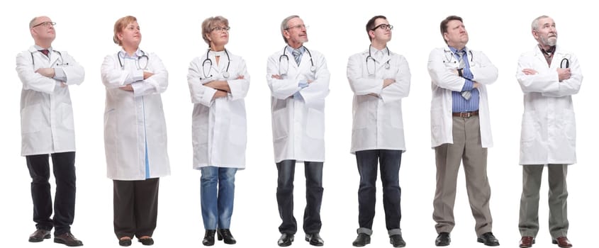 group of doctors standing in full length isolated on white background
