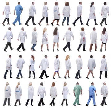 group of doctors in motion isolated on white background