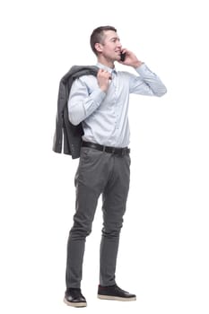 in full growth. smiling business man with a smartphone . isolated on a white background.