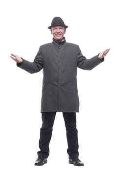 in full growth. intelligent man in a hat and autumn coat. isolated on a white background.