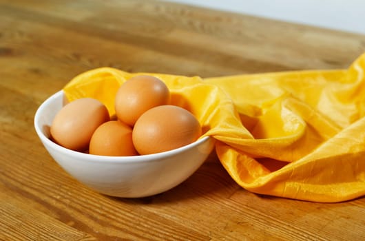  Chicken eggs in white bowl on wooden table  , preparing food , 