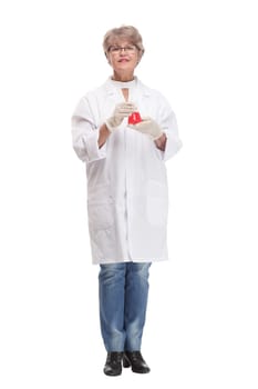 Studio shot of young happy woman doctor holding stethoscope and smiling while pointing finger up
