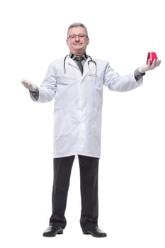 Doctor holding up beaker of red chemical in the laboratory. Isolated over white background