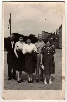 THE CZECHOSLOVAK SOCIALIST REPUBLIC - CIRCA 1970s: Vintage photo shows group of people stands in front of communist monument.