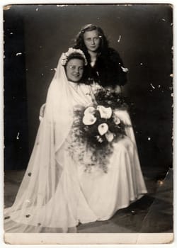 THE CZECHOSLOVAK SOCIALIST REPUBLIC - CIRCA 1960s: A vintage photo shows bride with her female friend.