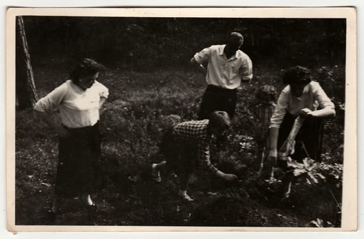 THE CZECHOSLOVAK SOCIALIST REPUBLIC - CIRCA 1960: A vintage photo shows family outdoors.