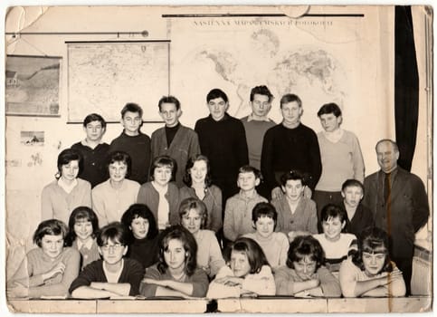 THE CZECHOSLOVAK SOCIALIST REPUBLIC - CIRCA 1960s: Retro photo shows students with male teacher in the classroom.