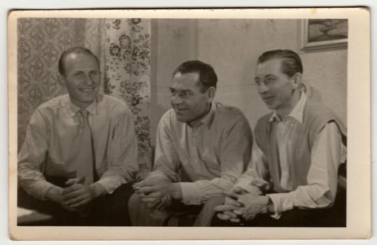 THE CZECHOSLOVAK SOCIALIST REPUBLIC - 1960s: Vintage photo shows men have a pleasant time at home.