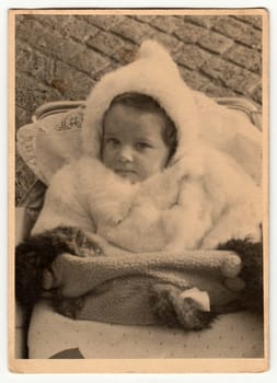 HODONIN, THE CZECHOSLOVAK REPUBLIC - CIRCA 1940: Vintage photo shows baby in pram baby carriage .