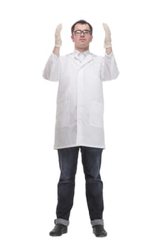 Cheerful male doctor in a white coat in gloves shows thumb up and holding the beaker