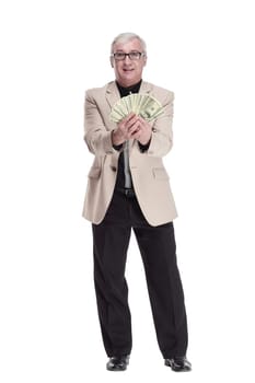 in full growth. happy intelligent man with banknotes. isolated on a white background.