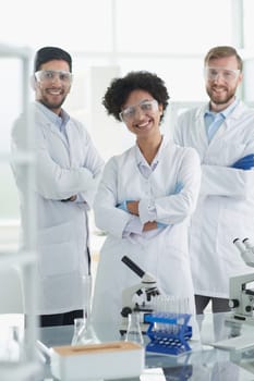 Scientists smiling together in lab