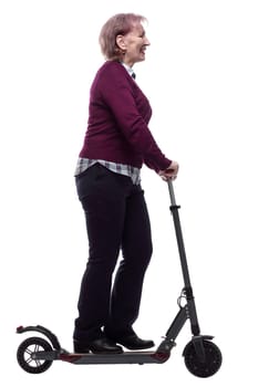 side view. friendly elderly woman on an electric scooter. isolated on a white