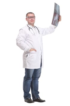 Side view of attractive doctor examining an x-ray and looking at the camera with positive