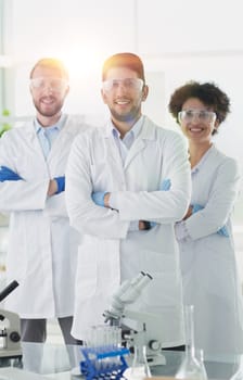 Scientists smiling together in lab