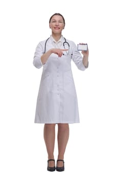 in full growth.medical doctor woman showing her visiting card. isolated on a white background.