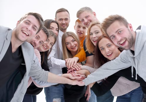 close up. a group of happy young people showing their unity