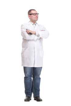 Smiling male doctor in scrubs with a stethoscope around his neck and his arms crossed isolated on white background