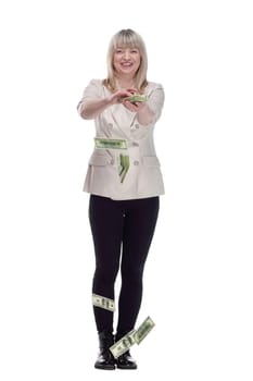 in full growth. very happy woman scattering a bundle of dollar bills. isolated on a white background.