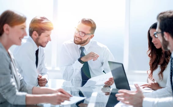 Frustrated business people sitting at the table in office.business concept