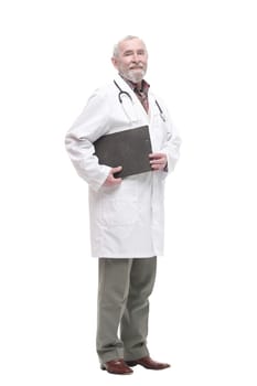 in full growth. elderly competent doctor with clipboard. isolated on a white background.