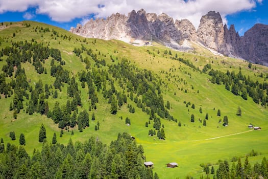 Idyllic landscape in Gardena pass valley and Sassolungo massif, italian Dolomites at springtime, Italy