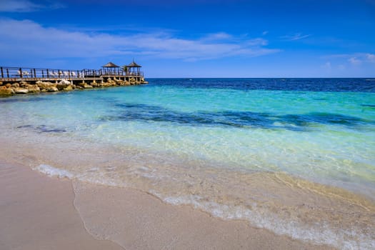 Tropical caribbean beach with turquoise waters in idyllic Montego Bay, Jamaica