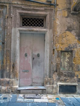 close up retro style old house door of Mediterranean architectural culture in Mediterranean island Malta. High quality photo